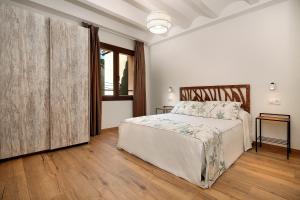 Postel nebo postele na pokoji v ubytování El Portal de Alquezar