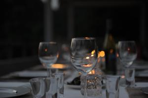 a group of wine glasses sitting on a table at Zen Box House in Yangshuo