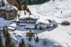 an aerial view of a house covered in snow at Ostello Angolo Verde in Angolo Terme