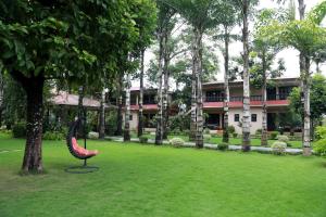 Κήπος έξω από το Hotel Parkland