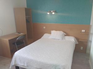 Ένα ή περισσότερα κρεβάτια σε δωμάτιο στο Auberge du Vieux Moulin