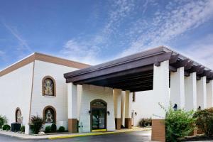 a church with a large building with a sky at Knights Inn Dayton by Miller Lane in Dayton