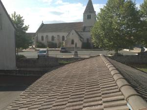 a brick walkway in front of a church at auberge du breuil vieux moulin in Le Creusot