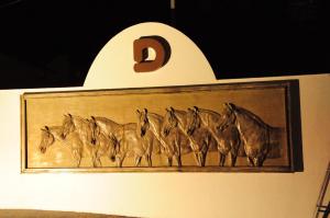 a group of horses painting on a wall with a letter d at Dalle Hotel in Bagé
