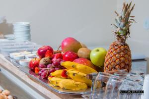 a tray of fruit sitting on a counter at Dalle Hotel in Bagé
