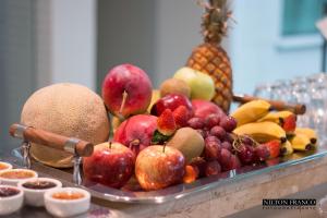 a tray of fruit on a table at Dalle Hotel in Bagé