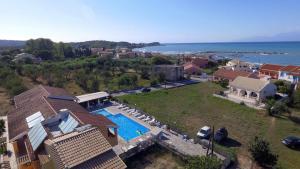an aerial view of a house with a swimming pool at Valentinos Apartments in Roda