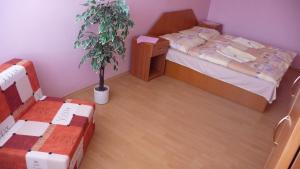 Postel nebo postele na pokoji v ubytování Hotel Štadión