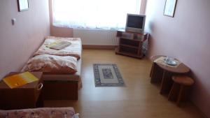 Postel nebo postele na pokoji v ubytování Hotel Štadión