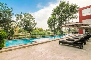 an image of a swimming pool at a hotel at Radisson Hotel Guayaquil in Guayaquil