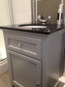 a bathroom vanity with a sink and a mirror at Bonners Lodge in Consett