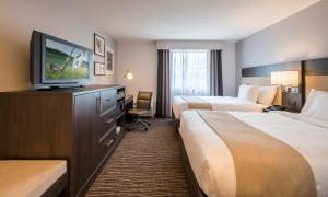 Postel nebo postele na pokoji v ubytování Country Inn & Suites by Radisson, Rochester-Pittsford-Brighton, NY