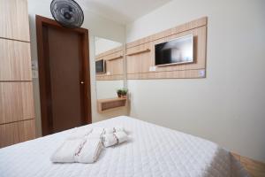 Ein Bett oder Betten in einem Zimmer der Unterkunft Pousada Giramundo