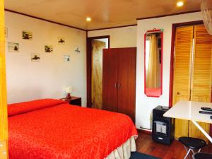 Cama o camas de una habitación en Nomades Chiloe Apart Hotel