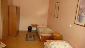 Postel nebo postele na pokoji v ubytování Hotel Štadión