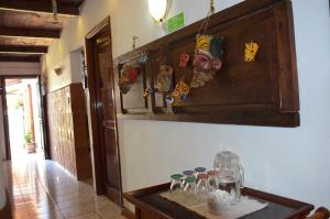 a room with a table with glasses on it at Dai Nonni Hotel in Guatemala