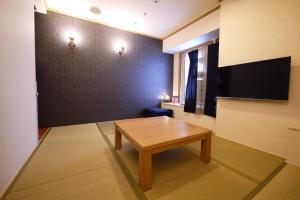 TV a/nebo společenská místnost v ubytování U-Community Hotel