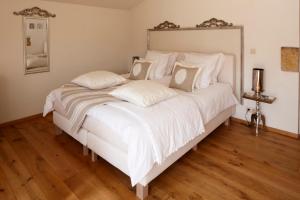 Postel nebo postele na pokoji v ubytování B&B Hof van Vervoering