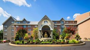 a building with a garden in front of it at Best Western Plus Concordville Hotel in Concordville