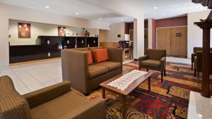 a living room with a couch and two chairs at Best Western Plaza Hotel Saugatuck in Saugatuck