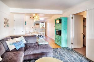 a living room with a brown couch and a blue cabinet at Waters Edge Condo in Ocean Shores