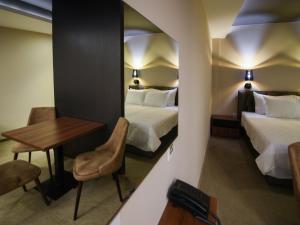 Ένα ή περισσότερα κρεβάτια σε δωμάτιο στο Hotel Ideo Lux