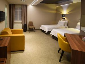 Ένα ή περισσότερα κρεβάτια σε δωμάτιο στο Hotel Ideo Lux