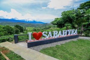 a sign that says sasha bahiti with a red heart at Sabah Tea Garden in Ranau