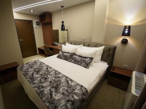 Ένα ή περισσότερα κρεβάτια σε δωμάτιο στο Hotel Ideo Lux