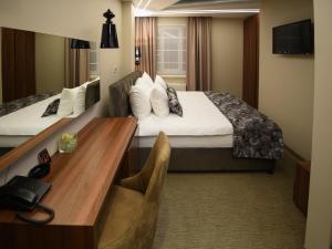 Ένα ή περισσότερα κρεβάτια σε δωμάτιο στο Hotel Ideo Lux