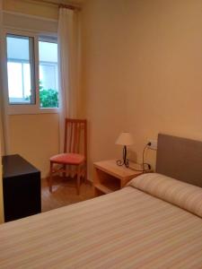 Posteľ alebo postele v izbe v ubytovaní Apartamento Columbretes