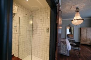 a bathroom with a shower with a glass door at Bowburn Hall Hotel in Durham +67 photos