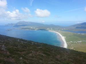 an aerial view of a beach and the ocean at High Road Cottage in Achill