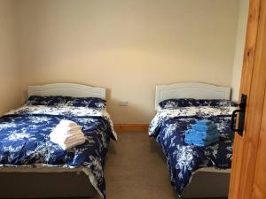 Cama ou camas em um quarto em High Road Cottage