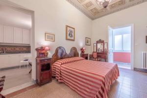 Posteľ alebo postele v izbe v ubytovaní Palazzo Benso
