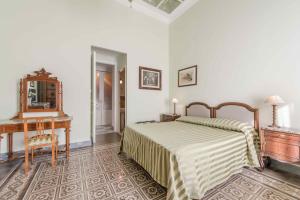 Posteľ alebo postele v izbe v ubytovaní Palazzo Benso