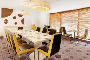 A seating area at KIMAYA Braga Bandung by HARRIS