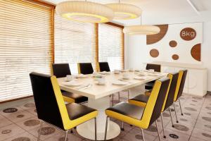 A seating area at KIMAYA Braga Bandung by HARRIS