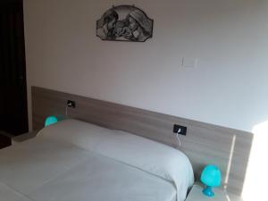 Postel nebo postele na pokoji v ubytování appartamento trieste
