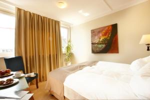Postel nebo postele na pokoji v ubytování Hotel am Kieler Schloss by Première Classe
