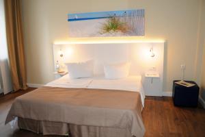 Postel nebo postele na pokoji v ubytování Hotel am Kieler Schloss by Première Classe