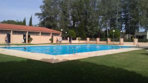 a large swimming pool in the middle of a yard at Casa Rural La Guapeta in Ademuz
