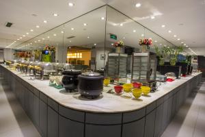 a long counter in a store with some drinks on it at Jinjiang Inn - Tianjin Train Station in Tianjin