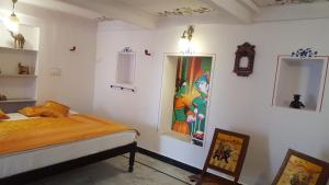 Postel nebo postele na pokoji v ubytování Hari Niwas Guest House