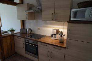 Η κουζίνα ή μικρή κουζίνα στο bluming inn - Ferienwohnung im Spreewald
