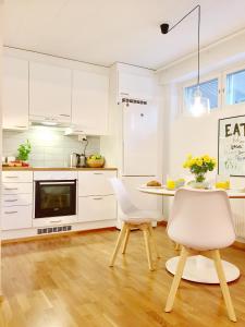 A kitchen or kitchenette at Lahti Center Design Apartment Uno