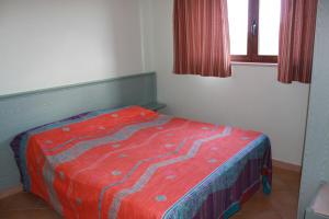A bed or beds in a room at Green Park Residence