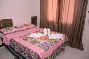 En eller flere senger på et rom på Pousada Pena