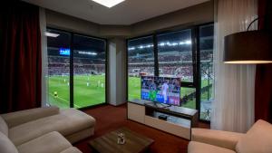 TV a/nebo společenská místnost v ubytování Hotel Arena