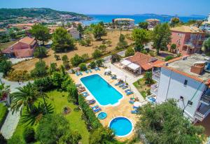 an aerial view of a resort with a swimming pool at Hotel Olga in Agios Stefanos